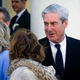 Mueller flashes a smile.
